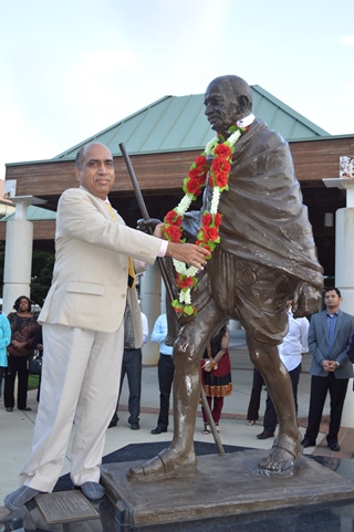 Gandhi_Dep. Consul General, Ashok Kumar garlanding the Gandhi Statue320.jpg